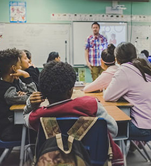 Children and a teacher in a classroom